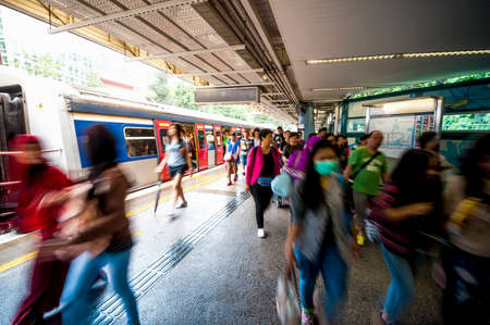Hong Kong, China - October 4, 2015 : People waiting for delay MTR train while Typhoon Mujigae moving on land with No 3 strong wind signal.のeditorial素材