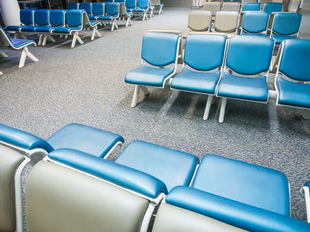 Row of chairs in airport at night