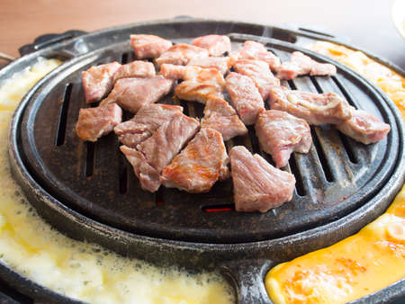 Korean style barbecue pork on charcoal.の写真素材
