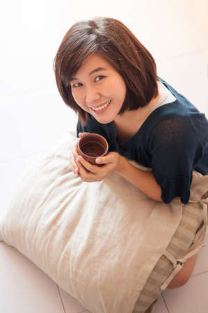 Young asian woman enjoy drinking tea.