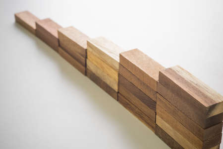 Wood block stacking as step stair. Business concept for growth success process.の写真素材