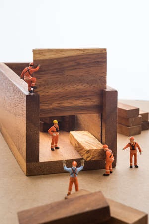 Worker moving goods package out from store.の写真素材