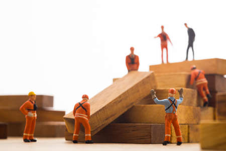 Worker making wood step stair. Success building concept.の写真素材