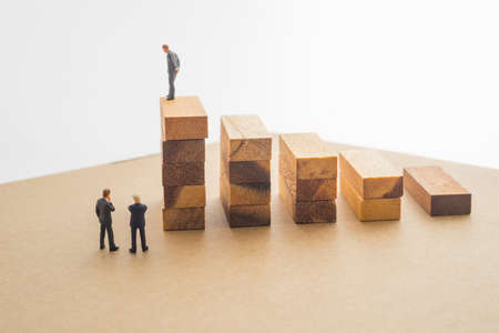Businessmen talking about wood block step, Successive business concept.の写真素材