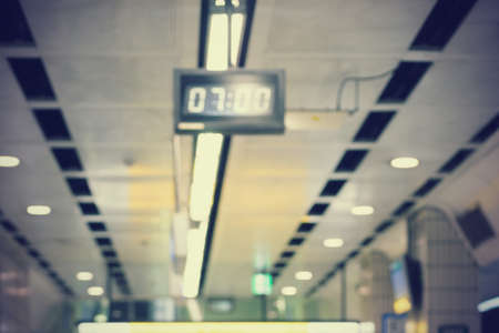 Blur background of digital clock in train station. Vintage image processedの写真素材