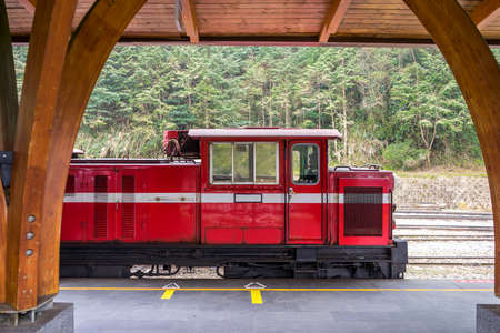 Red train on railway forest in Alishan National Scenic Area, Taiwan.のeditorial素材