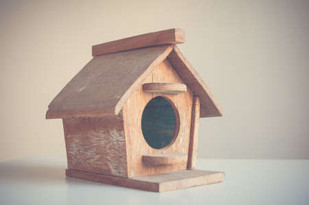 Wooden bird house on a white backgroundの写真素材
