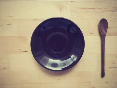 Empty plate on wood tableの写真素材