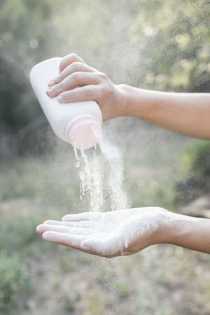 Baby powder product with talcum mineral spilling over airの写真素材