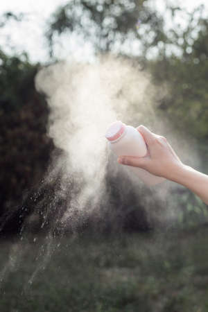 Baby powder product with talcum mineral spilling over airの写真素材