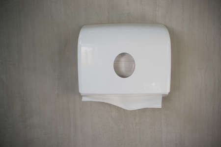 Toilet paper. Box of toilet paper on cement wall.の写真素材