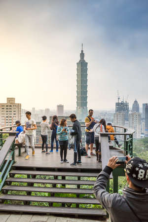 Taipei, Taiwan - March 04, 2016: Tourists at the Elephant Mt. in Taipei. Tourists are hiking at the Nangang District Hiking Trail for the best view of Taipei City.のeditorial素材
