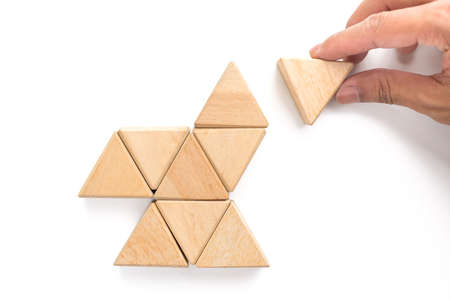 Triangles wood block arranging as stack step can use for business template or bullet or infographic. Wood block on white background.の写真素材