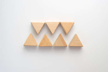Triangles wood block arranging can use for business presentation template or bullet or infographics. Business concept for growth success process.の写真素材