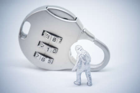 Business security concept. A specialist standing in front of key lock with password.の写真素材