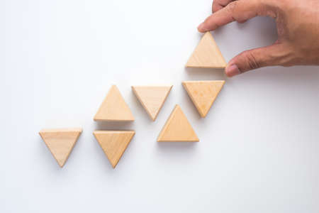 Hand aranging wood block. Business concept for growth success process.の写真素材