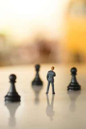 Concept of business strategy. Businessman with a chess pawn.の写真素材