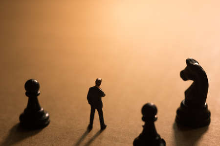 Concept of business strategy. Businessman with a chess game.の写真素材