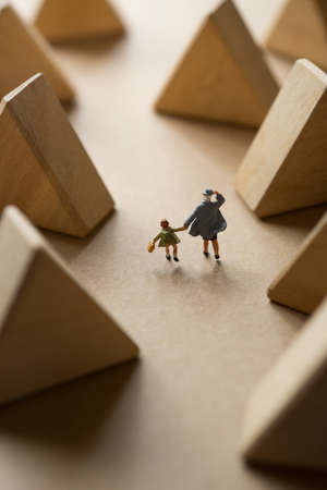 Concept of children education planing. Mother and daugher holding hand after school.の写真素材