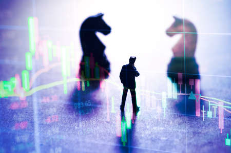 Concept of stock market strategy. Stock market number on screen display with businessman and chess...