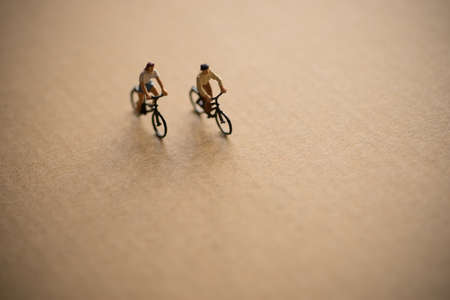 Miniature model figure of couple enjoy riding bicycle.の写真素材