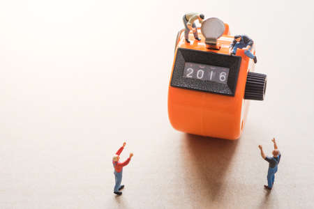 Concept of Happy New year 2017 celebration. Worker on tally counter try to change number 2016 to 2017.の写真素材
