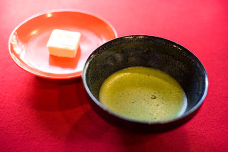 Japanese Matcha traditional green tea serving with dessert.の写真素材