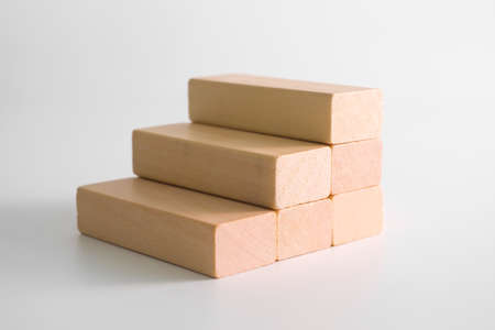 Wood block stacking as step stair. Business concept for growth success process.