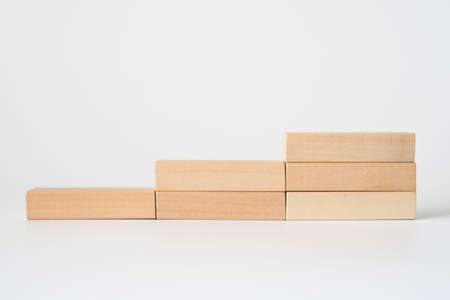 Wood block stacking as step stair. Business concept for growth success process.の写真素材