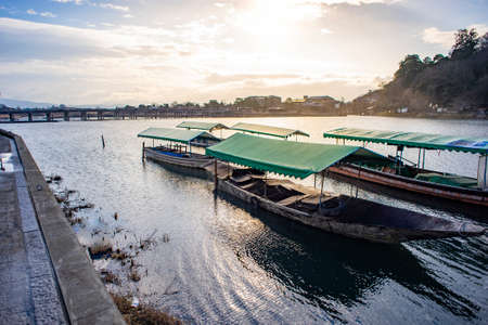 Travel boats docking at Katsura River, Kyoto, Japan.