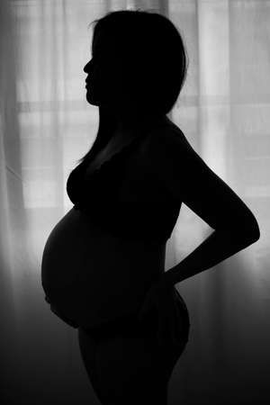 Silhouette pregnant woman の写真素材