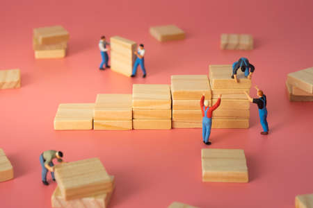 Worker arranging wood step stair. Business concept of processの写真素材