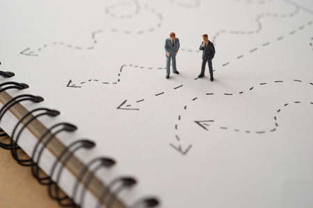 Business decision concept. Businessman thinking with many arrow path.の写真素材