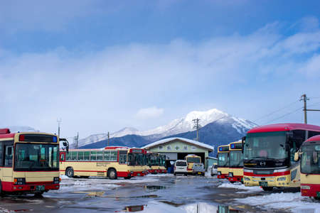 Nagano, Japan - February 13, 2017 : Shuttle bus stopping at Yudanaka bus station in winter