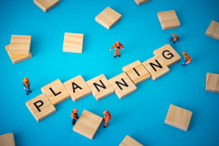 Business concept of planning. Workers arranging wood with textの写真素材