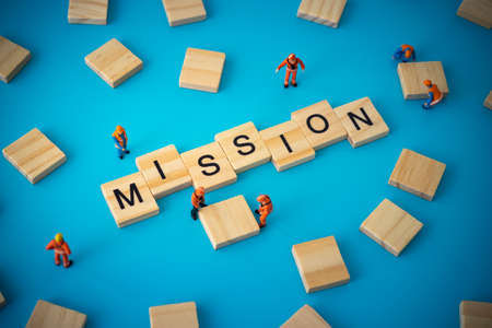 Business concept of mission. Workers arranging wood with textの写真素材