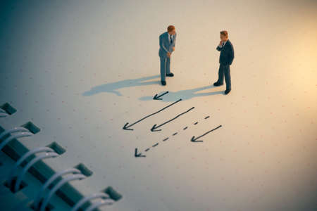 Business decision concept. Businessman thinking with many arrow path.の写真素材