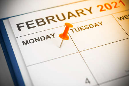 Red push pin on calendar Mondayの写真素材