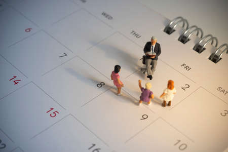International Children's book day celebrated on 2nd April. Elder reading book with kids waiting to listening.の写真素材