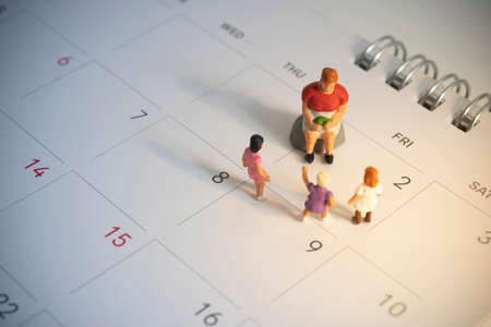 International Children's book day celebrated on 2nd April. Elder reading book with kids waiting to listening.の写真素材