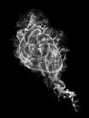 abstract human heart in a smoke on a black backgroundの写真素材