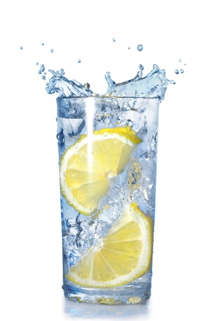 two lemons fell in a glass with water isolated on white 
の写真素材