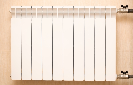 white radiator over yellow backgroundの写真素材