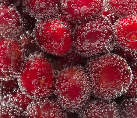 cherry in water with bubbles.