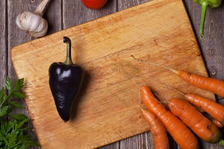 Ripe vegetables on a wooden tableの写真素材