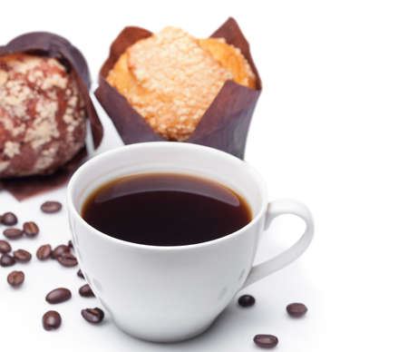Cup of coffee and muffins isolated on white background. Depth of Fieldの写真素材
