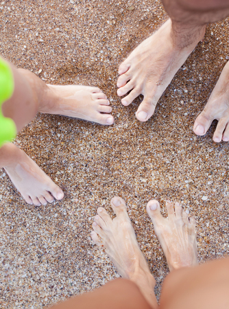 happy family is resting on the seashore