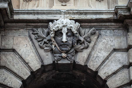 female face on a bas-relief in the castle. Hungary Budapest