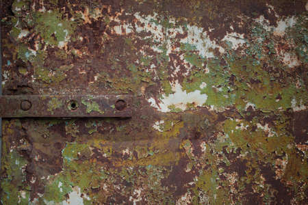 Iron texture with rusty spots and traces of paint
