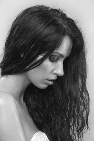 Sexy girl. Wet beauty portrait studio.